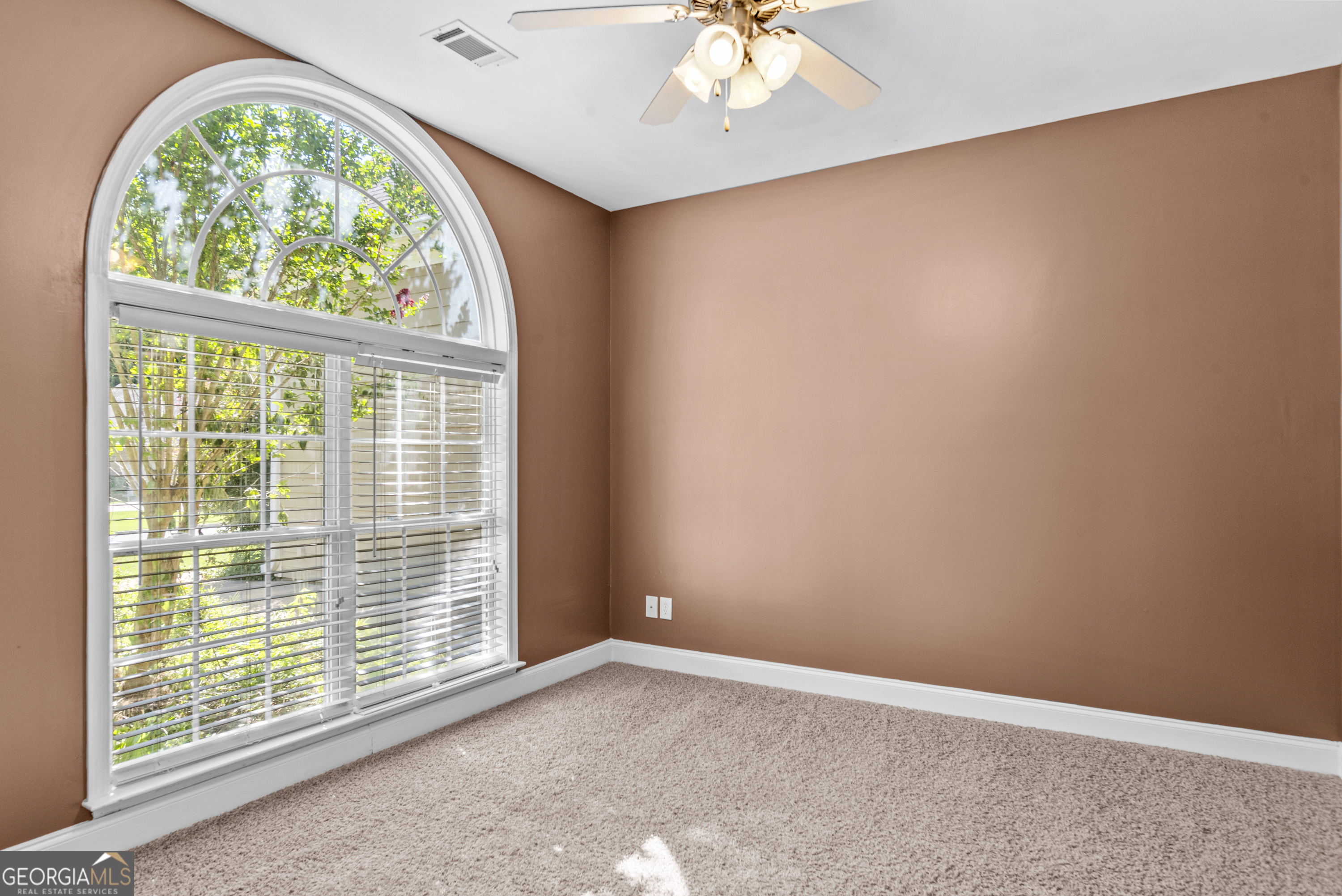 1141 Whispering Lakes Trail Madison, GA 30650 - Photo 15 of 40 an empty room with a window