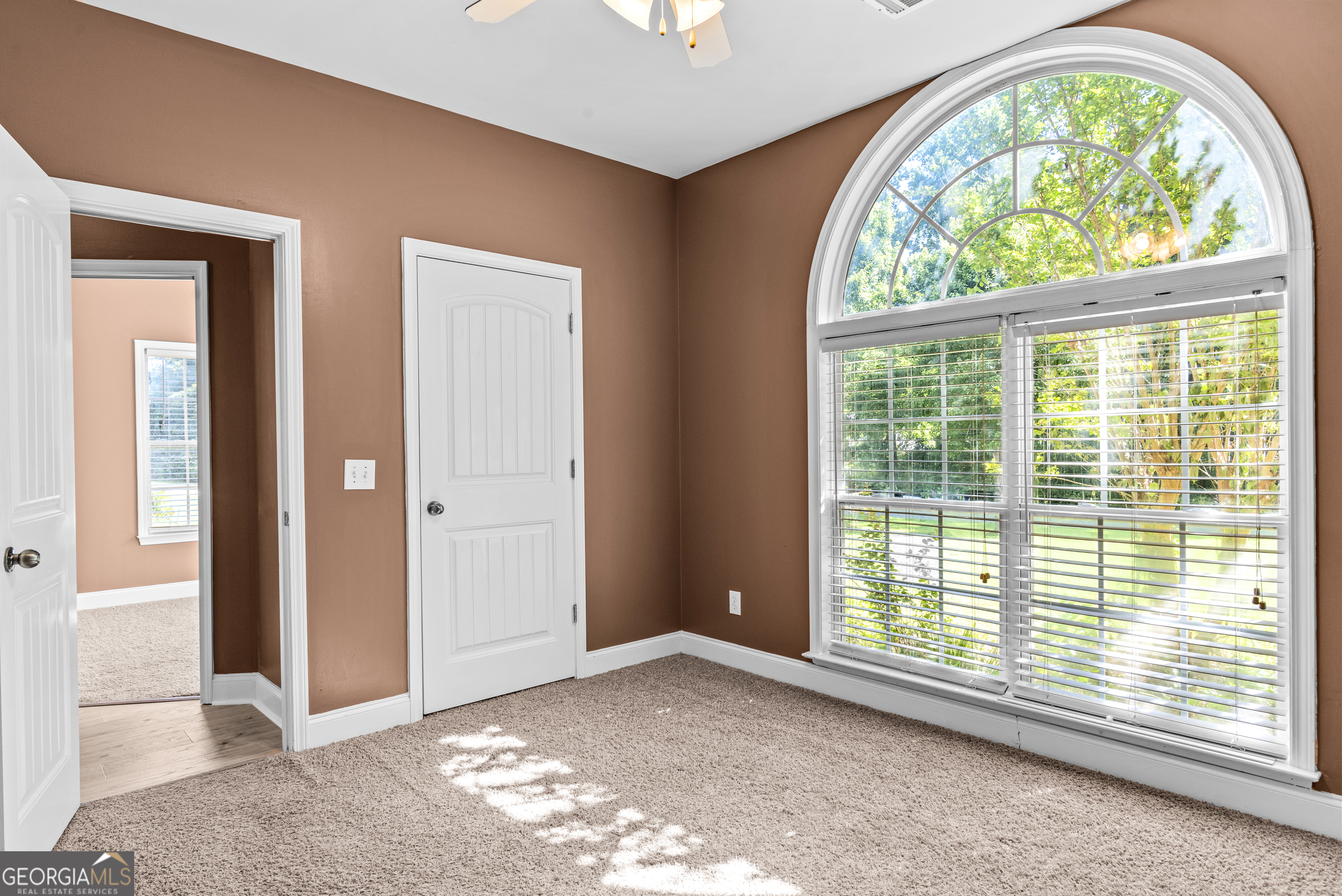1141 Whispering Lakes Trail Madison, GA 30650 - Photo 16 of 40 an empty room with a view of front door