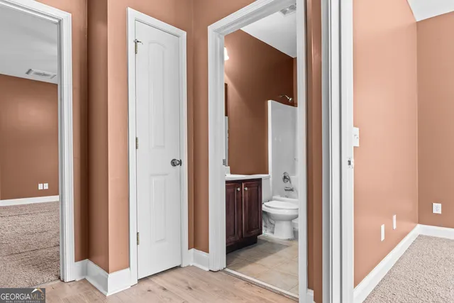 a view of bathroom with a toilet and a shower