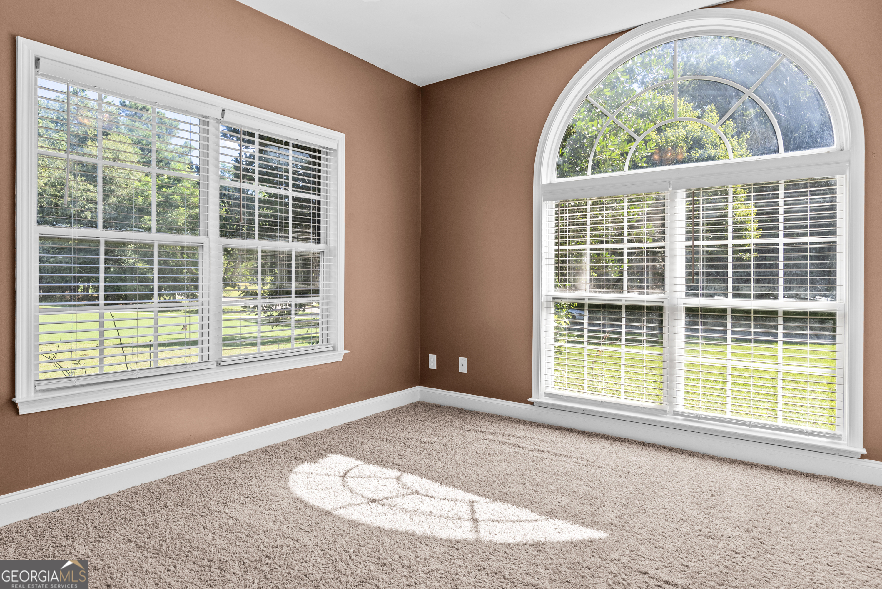 1141 Whispering Lakes Trail Madison, GA 30650 - Photo 18 of 40 an empty room with a window