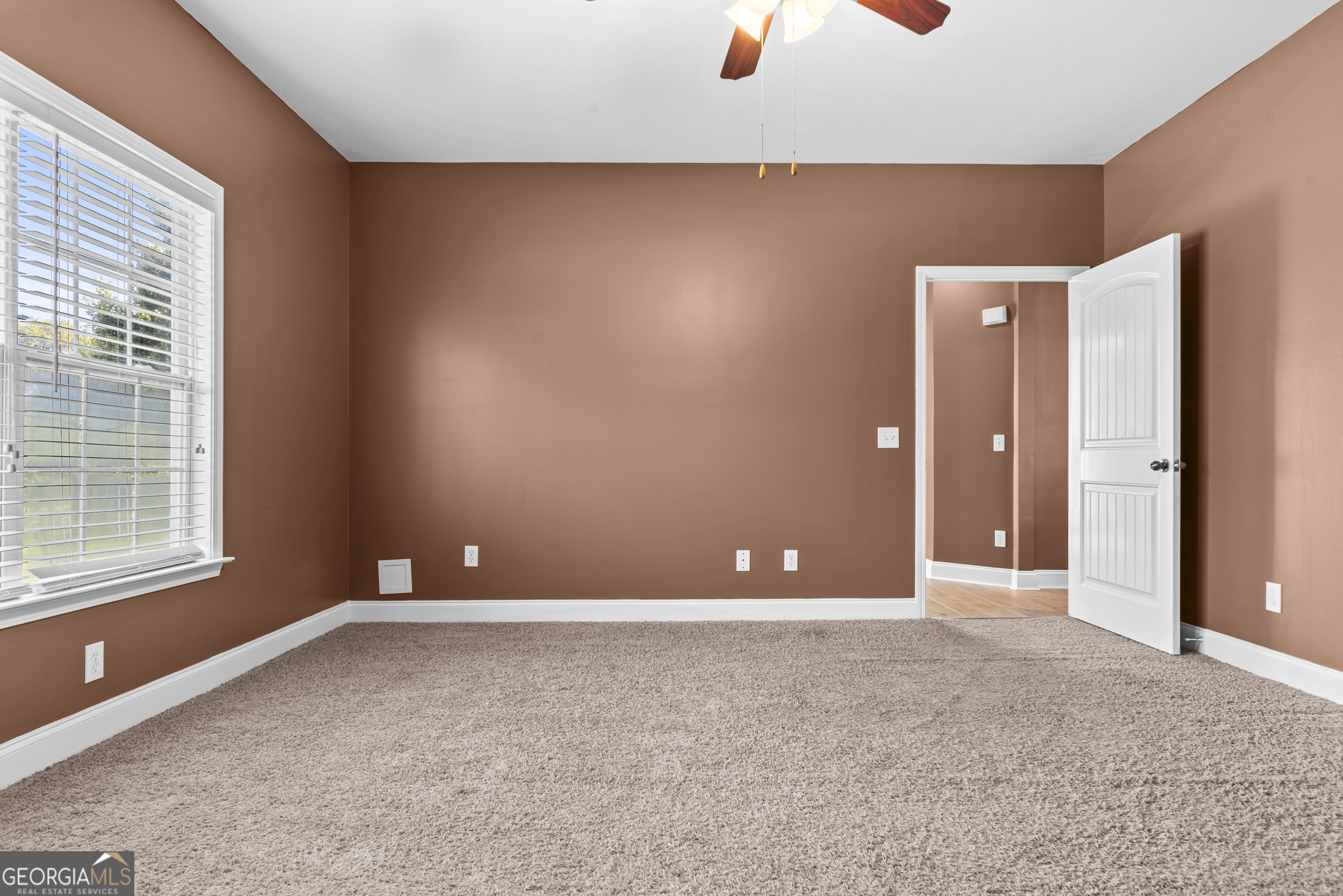 1141 Whispering Lakes Trail Madison, GA 30650 - Photo 30 of 40 an empty room with a natural light