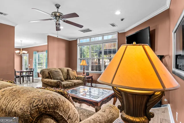 a bedroom with a bed window and couch