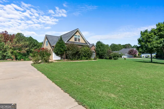 a front view of a house with garden