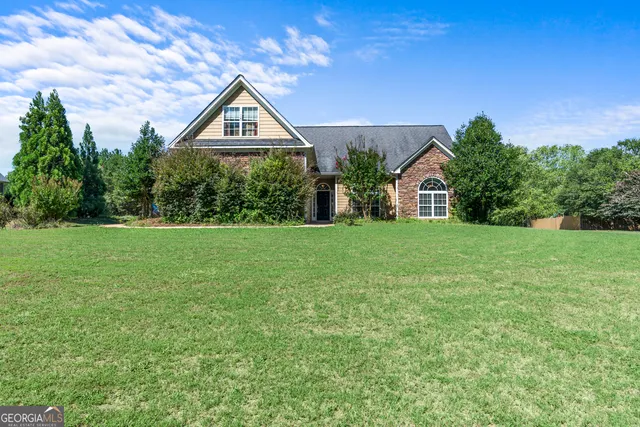 front view of a house with a yard
