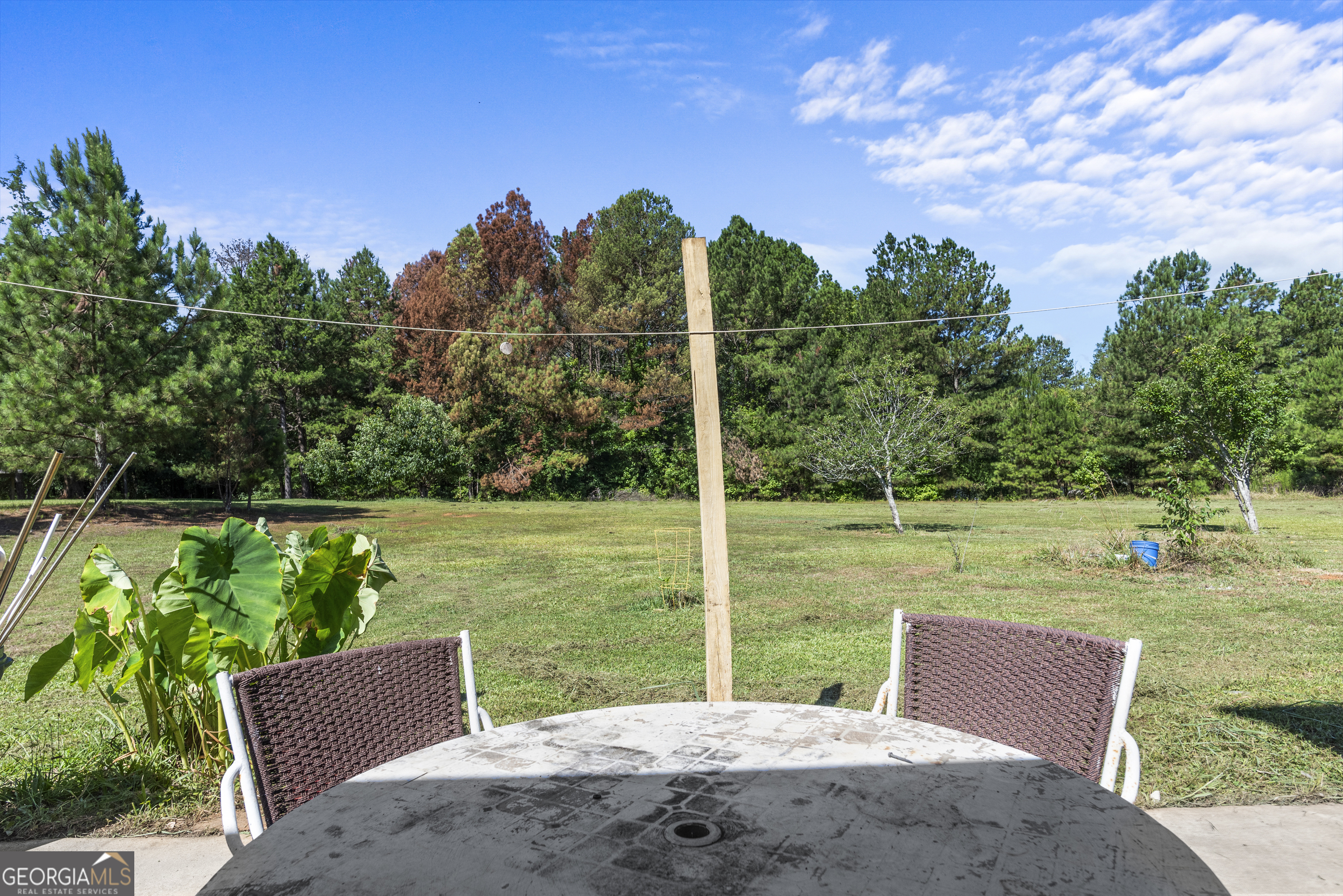 1141 Whispering Lakes Trail Madison, GA 30650 - Photo 36 of 40 a view of a wooden deck with a big yard