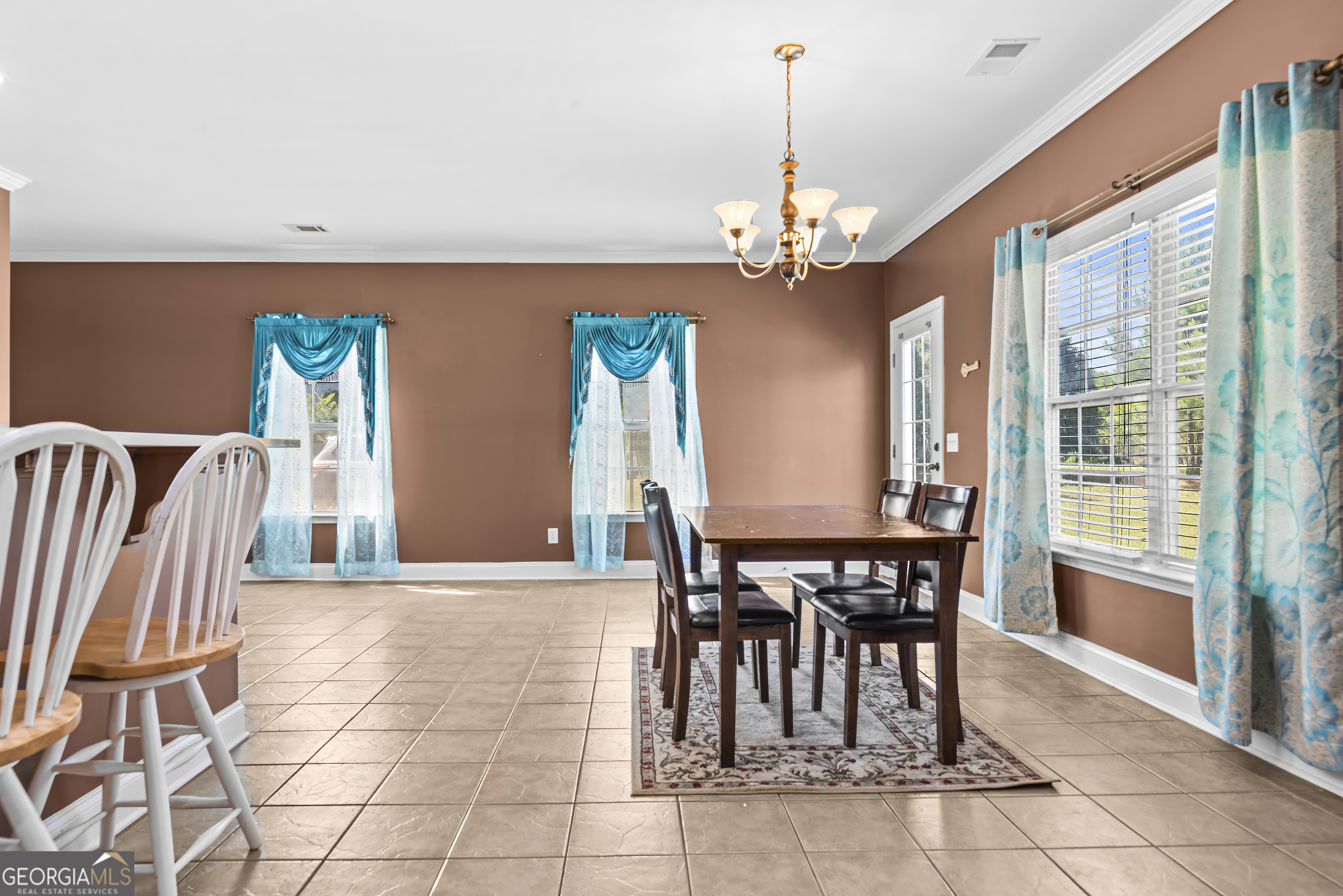 1141 Whispering Lakes Trail Madison, GA 30650 - Photo 7 of 40 a view of a dining room with furniture and window