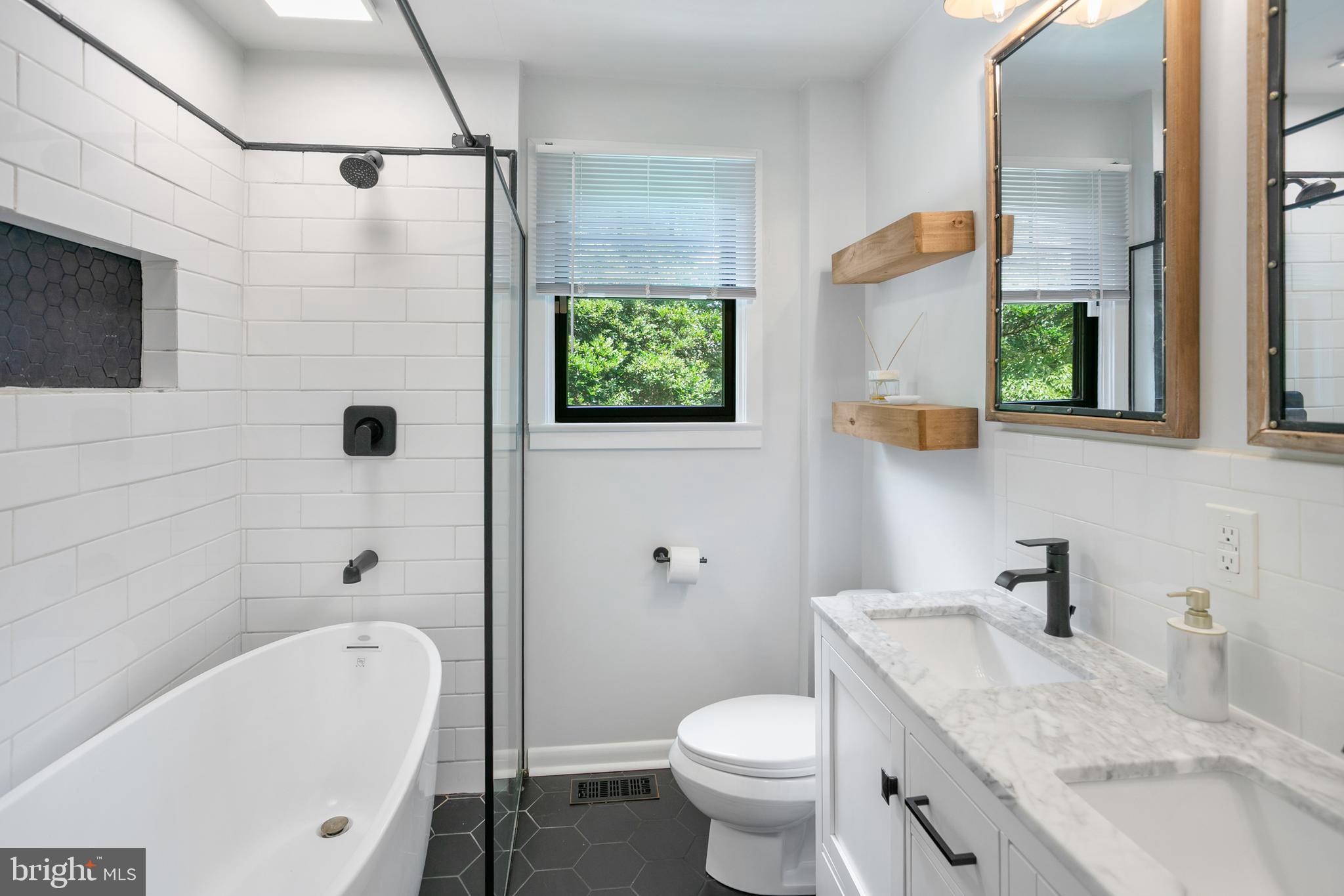 5 Spring Hill Court Chevy Chase, MD 20815 - Photo 18 of 50 a bathroom with a granite countertop sink toilet and shower