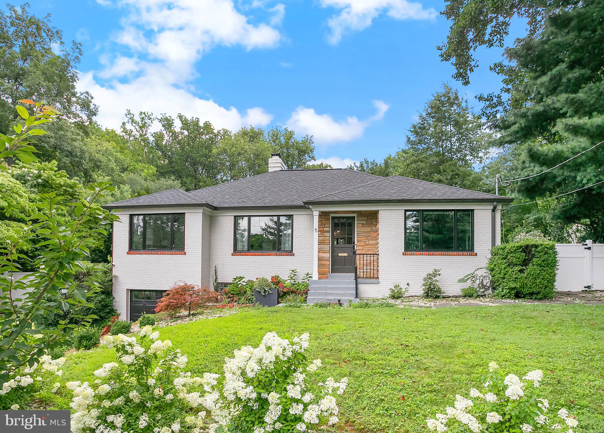 5 Spring Hill Court Chevy Chase, MD 20815 - Photo 2 of 50 a front view of house with yard and trees