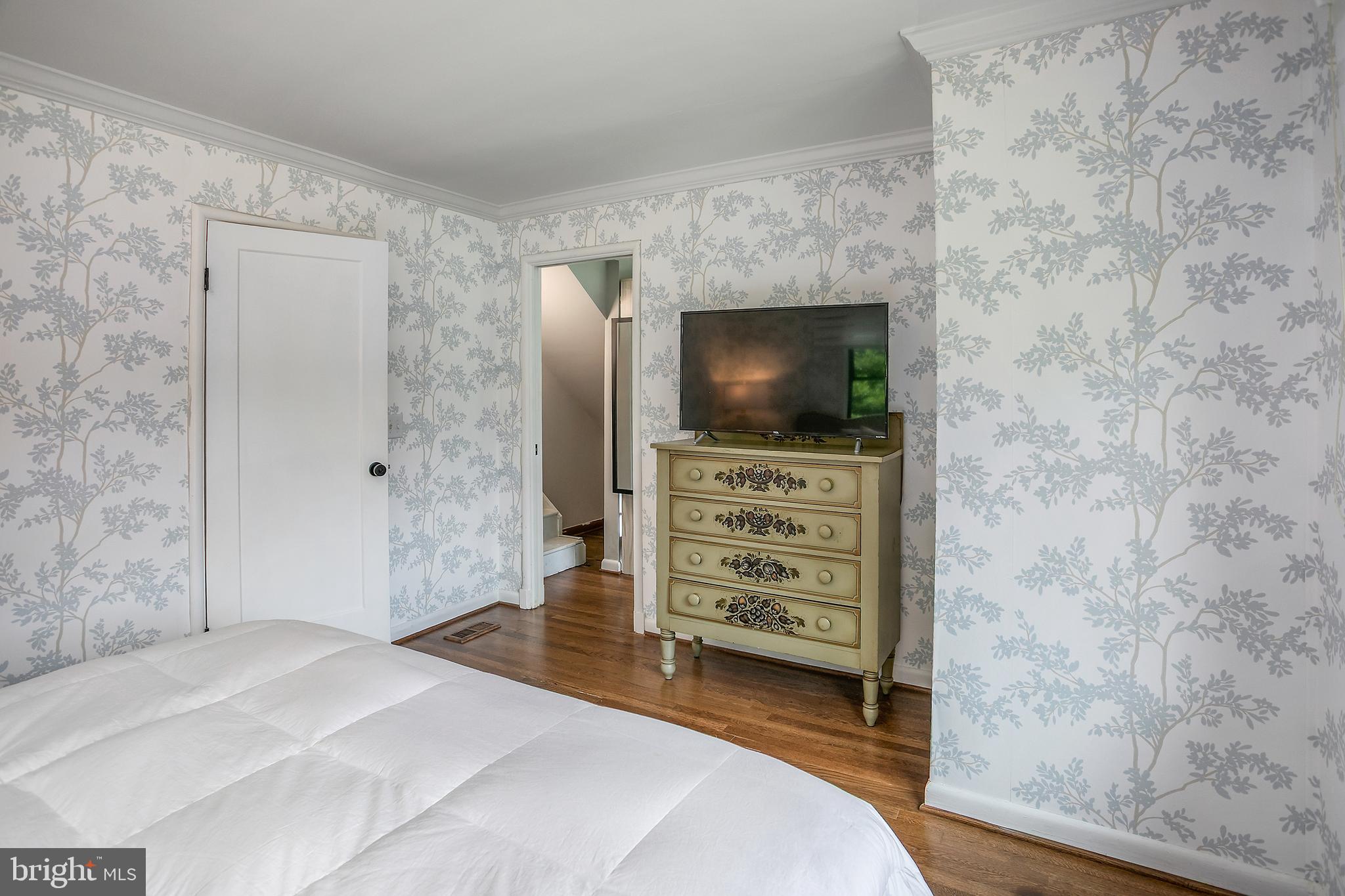 5 Spring Hill Court Chevy Chase, MD 20815 - Photo 22 of 50 a bedroom with a bed and a flat screen tv