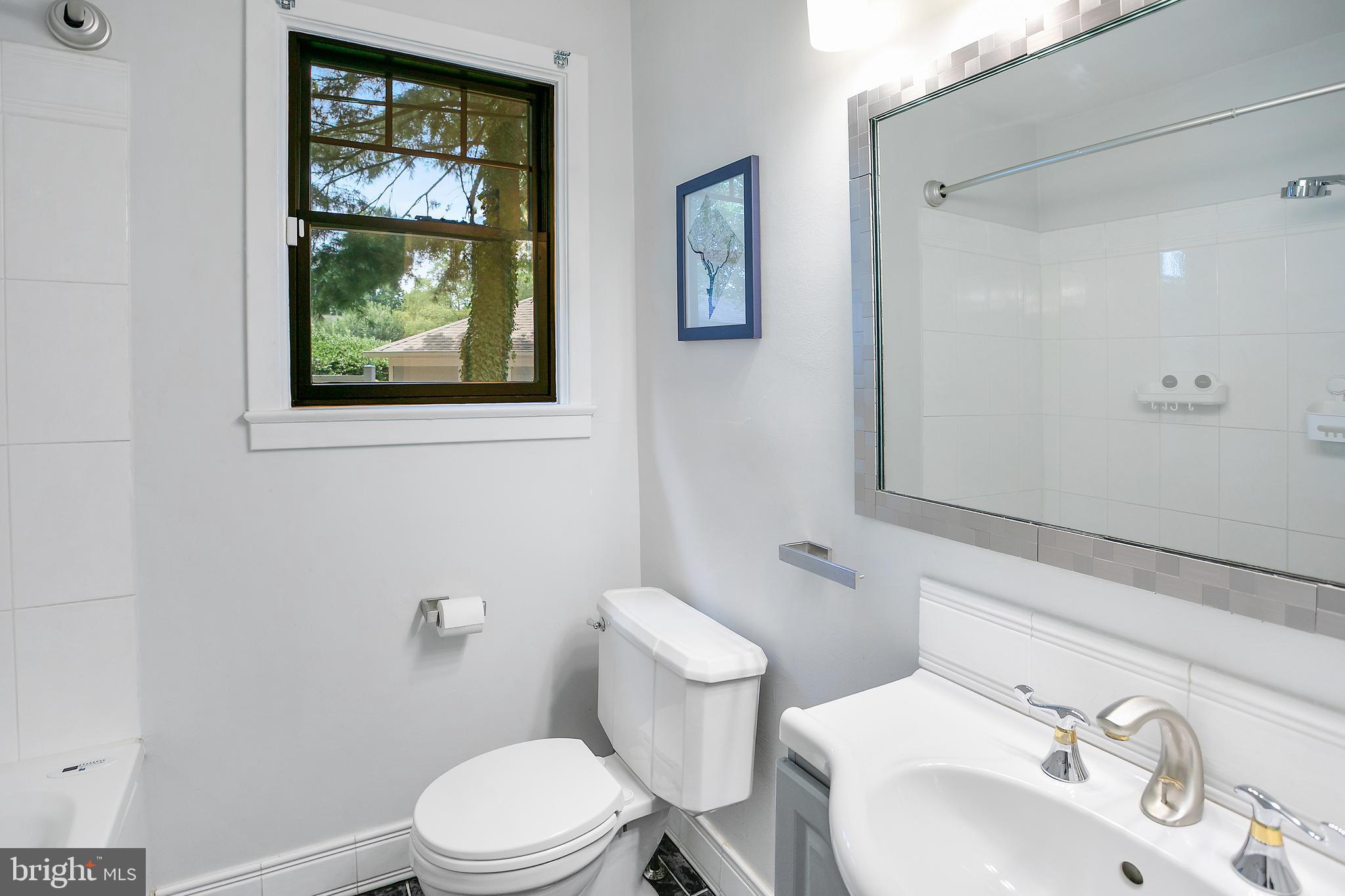 5 Spring Hill Court Chevy Chase, MD 20815 - Photo 27 of 50 a white toilet sitting next to a bathroom sink