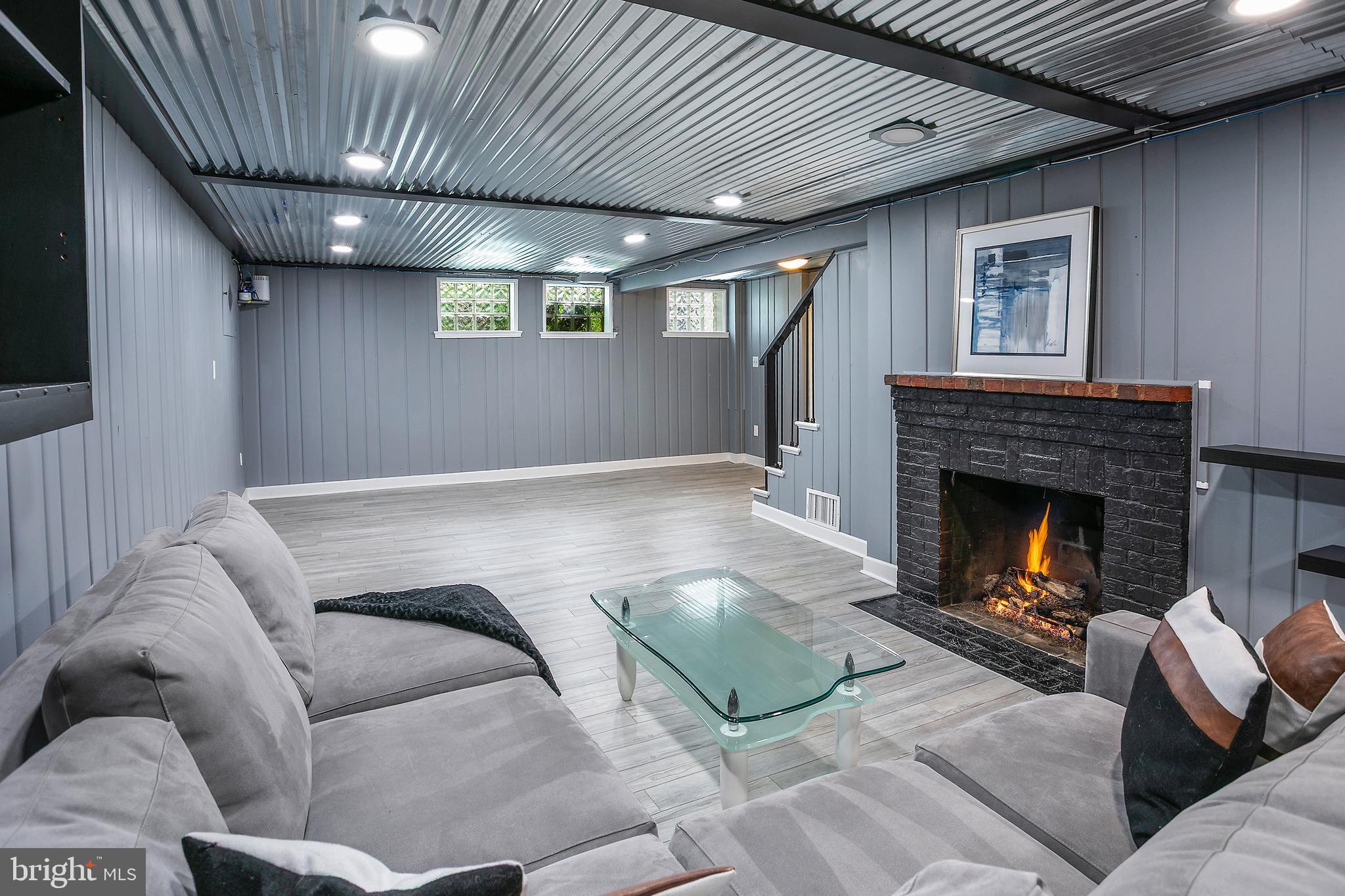 5 Spring Hill Court Chevy Chase, MD 20815 - Photo 32 of 50 a living room with furniture and a fireplace