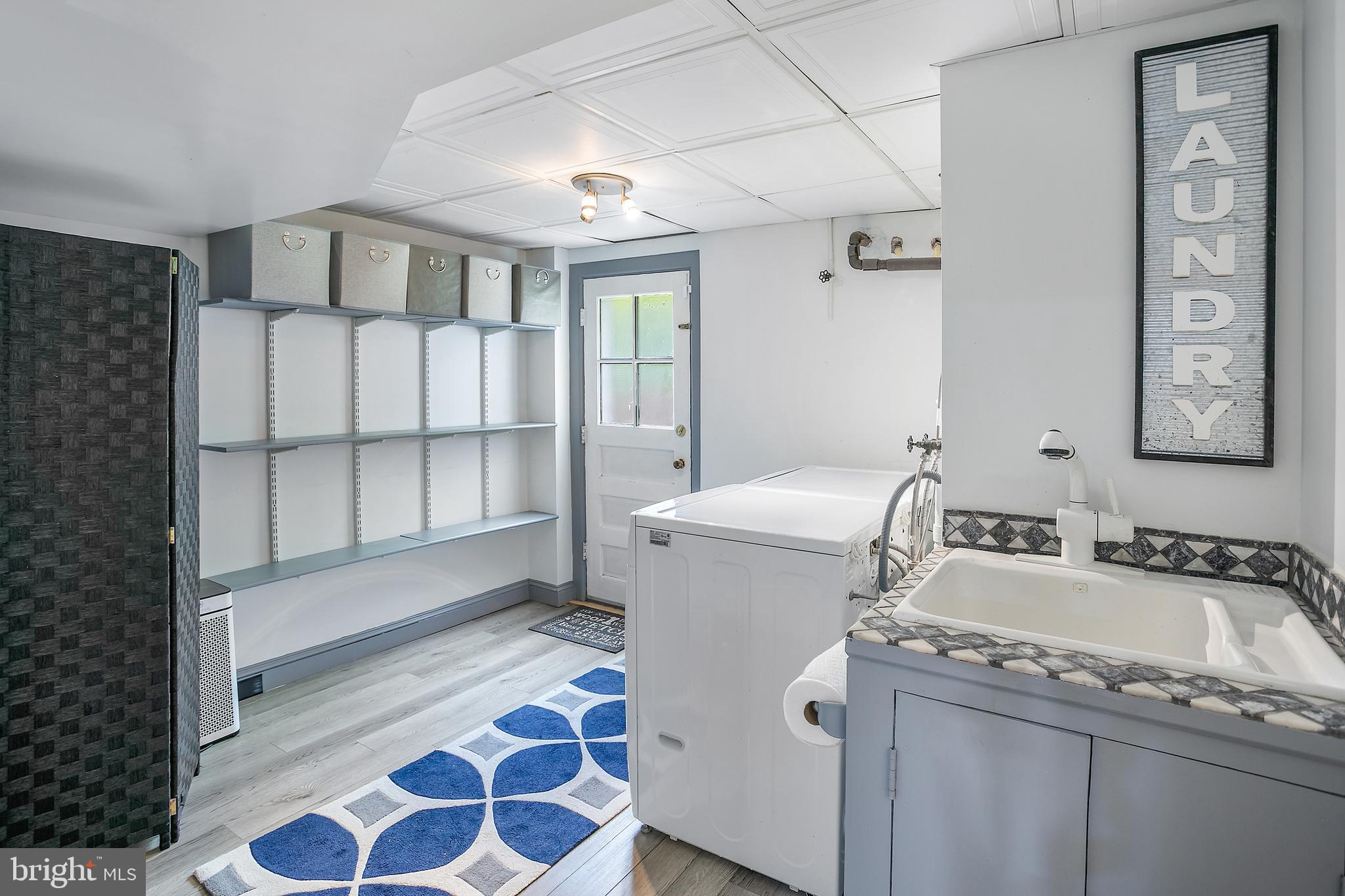 5 Spring Hill Court Chevy Chase, MD 20815 - Photo 36 of 50 a bathroom with a sink and a mirror