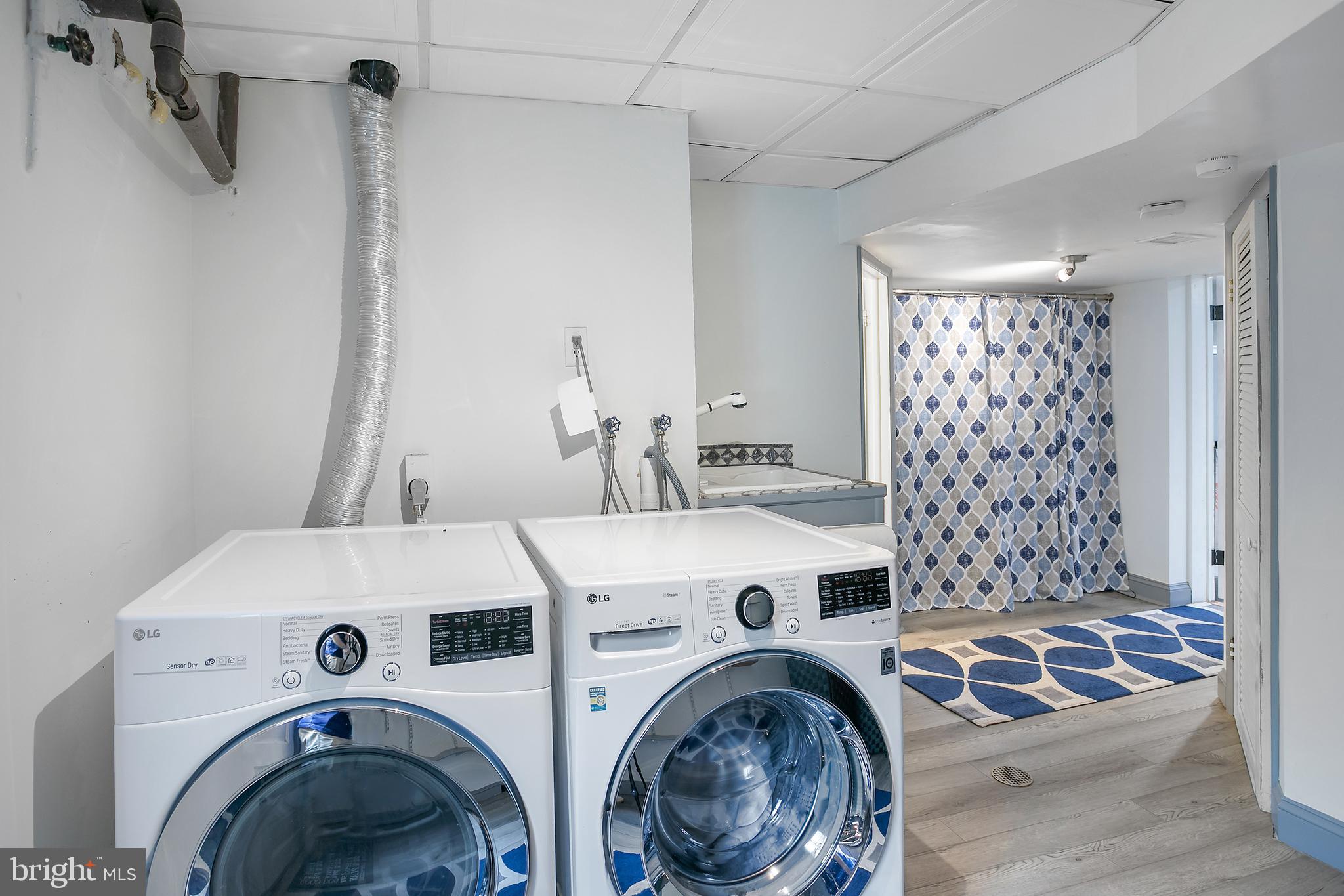 5 Spring Hill Court Chevy Chase, MD 20815 - Photo 37 of 50 a utility room with dryer and washer