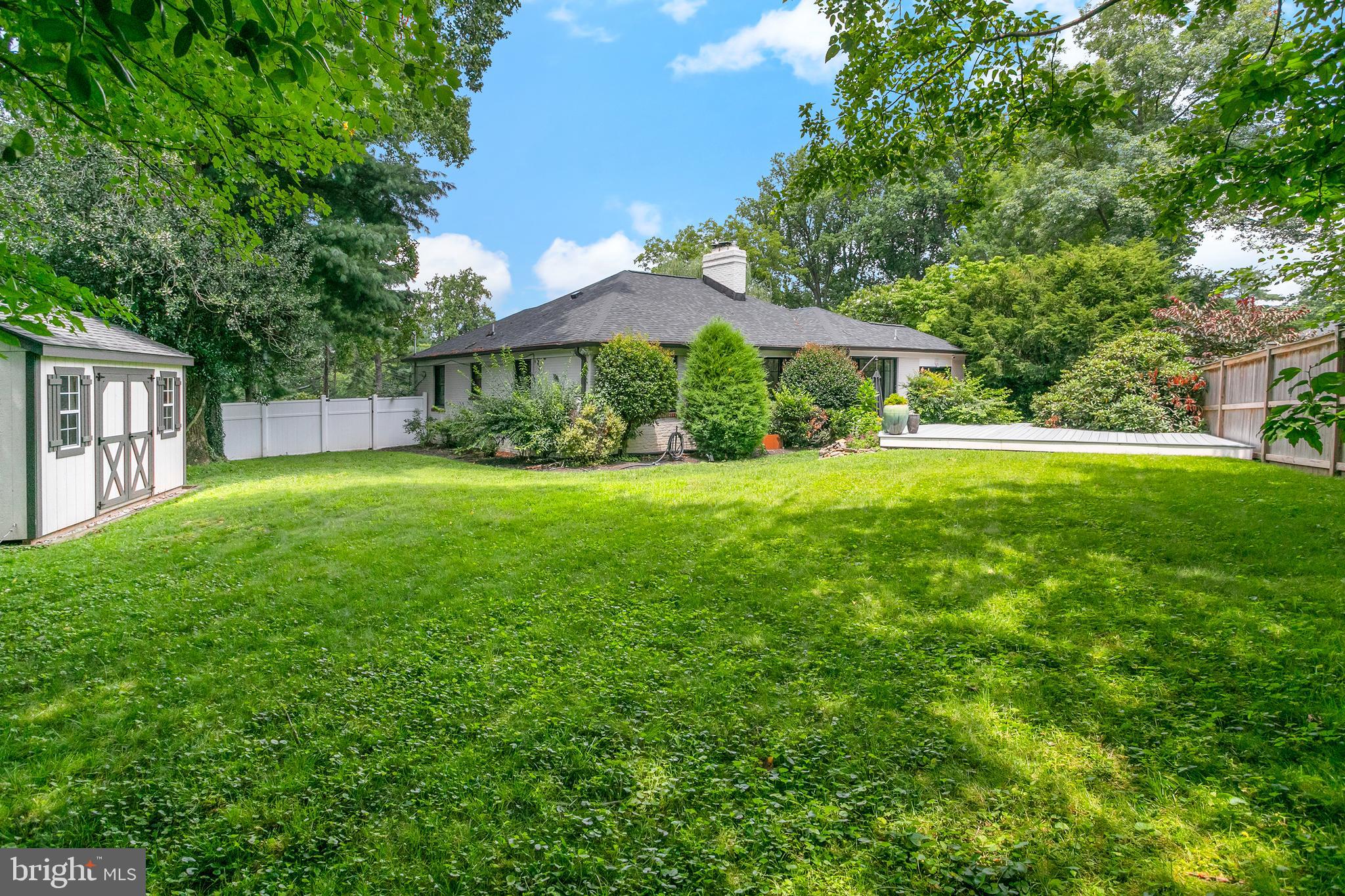 5 Spring Hill Court Chevy Chase, MD 20815 - Photo 42 of 50 a view of a house with a big yard potted plants and large tree