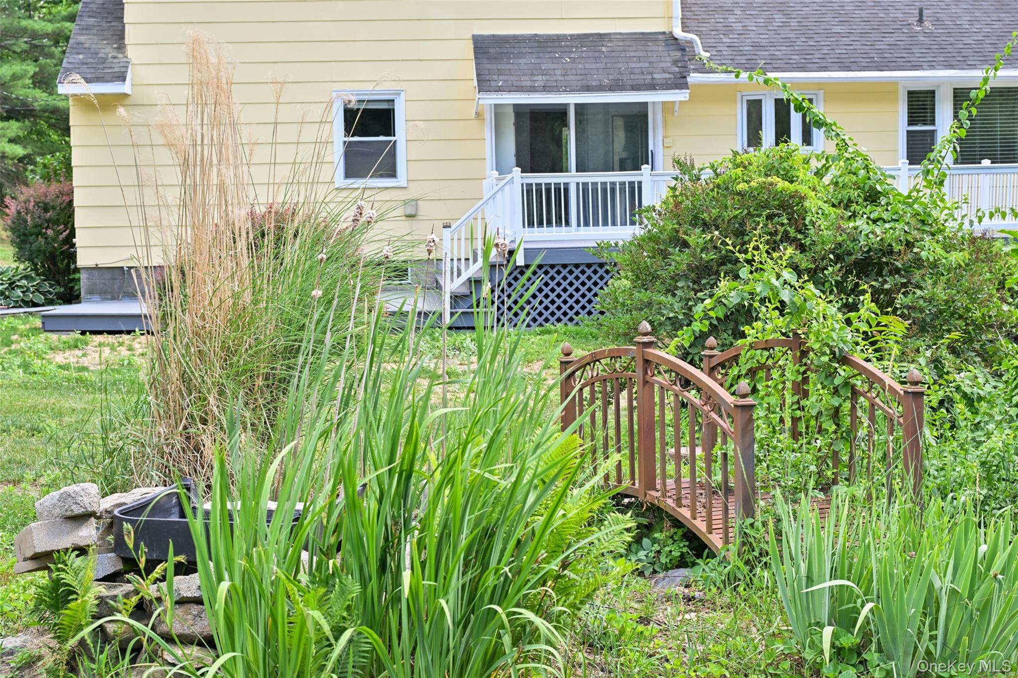 136 Foggintown Road Brewster, NY 10509 - Photo 48 of 50 a view of a house with pool and garden
