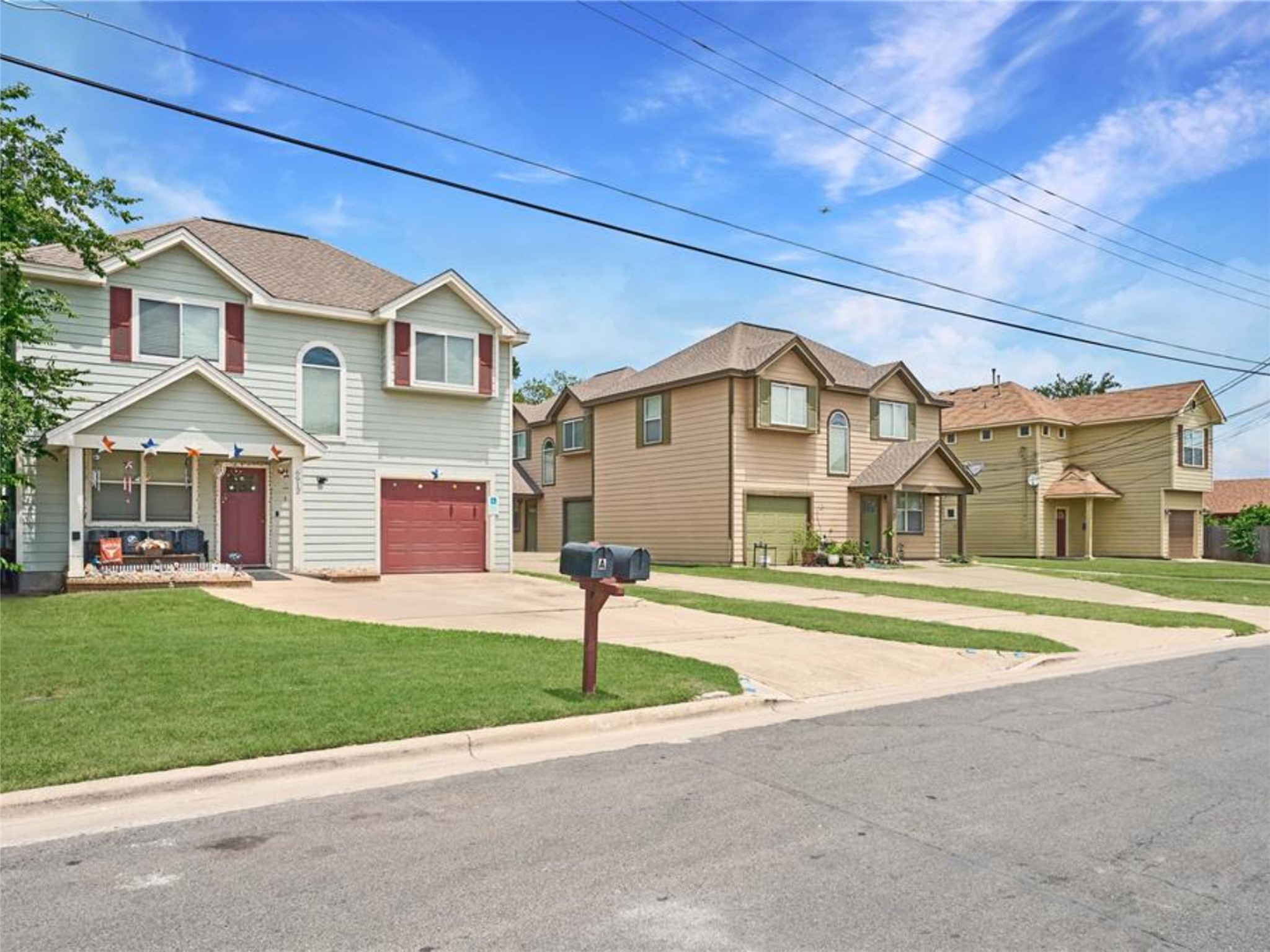 6916 Meador Avenue Austin, TX 78752 - Photo 7 of 29 a front view of a house with a garden and plants