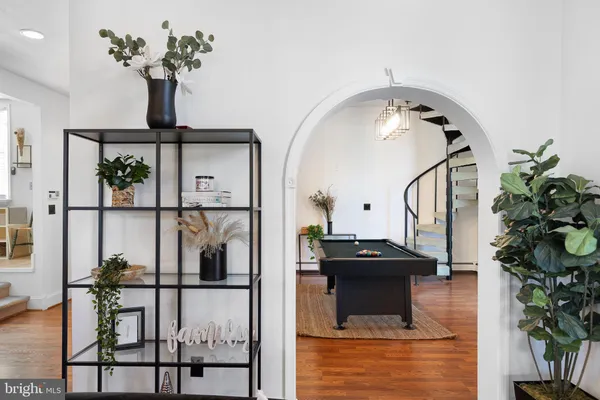 a view of a living room and hardwood floor
