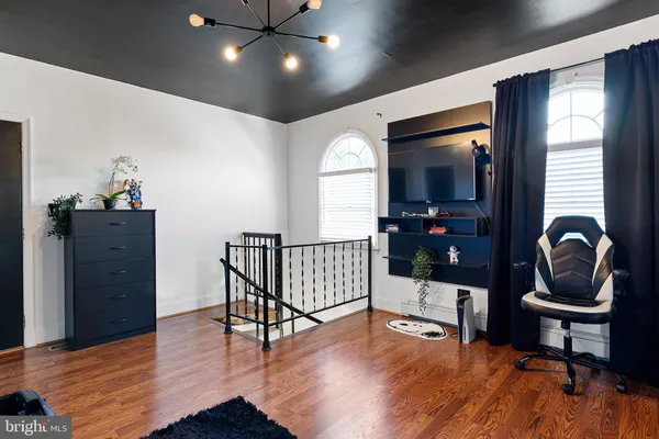 view of living room with furniture and a large window