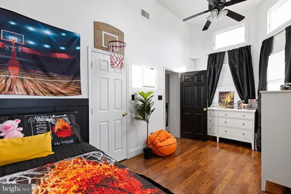 a bedroom with a bed and a chair