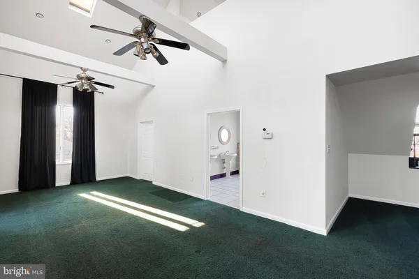 a picture of a bench in a white wall