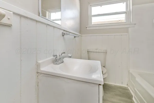 a bathroom with a sink and vanity