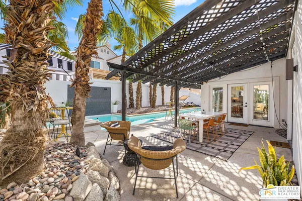 a view of a patio with chairs and tables