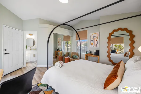 a bed room with a bed and windows