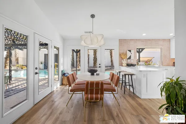 a dining room with furniture and window