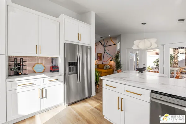a view of a livingroom with furniture and wooden floor