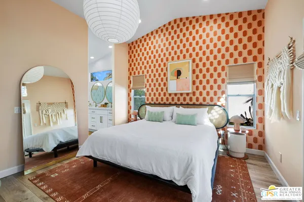 a spacious bathroom with a granite countertop sink and a mirror
