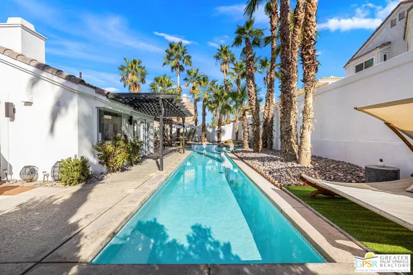 a view of swimming pool with a patio