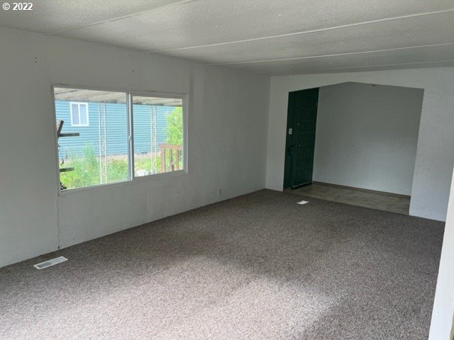 88148 5th Street Veneta, OR 97487 - Photo 7 of 20 a view of an empty room with a window