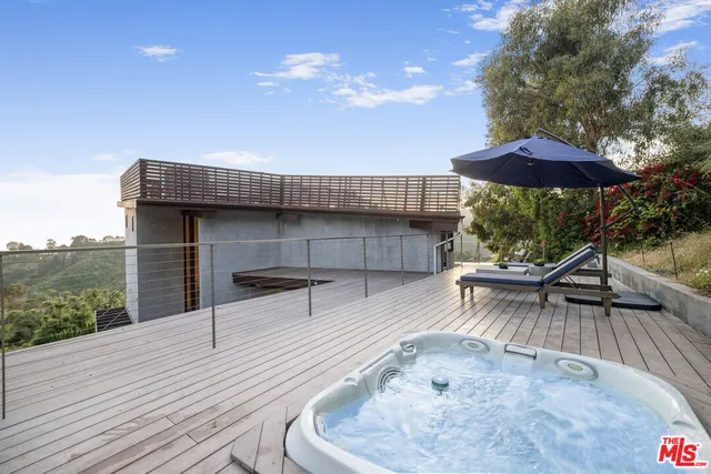 swimming pool view with a seating space