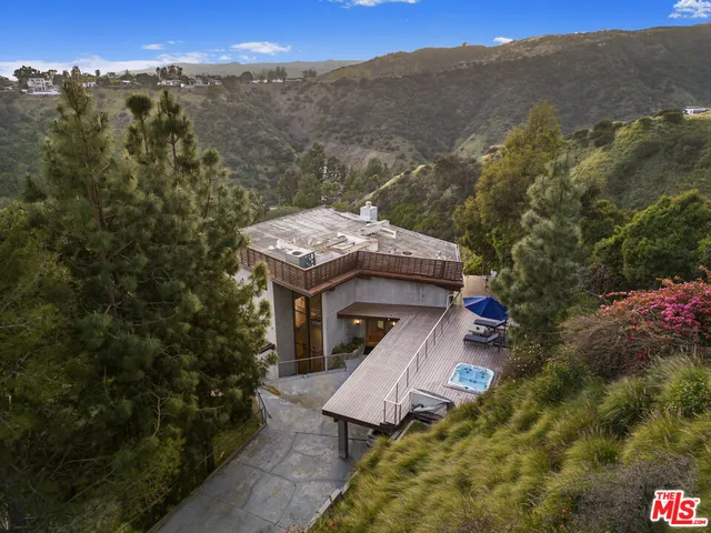 a living room with furniture fireplace and flat screen tv