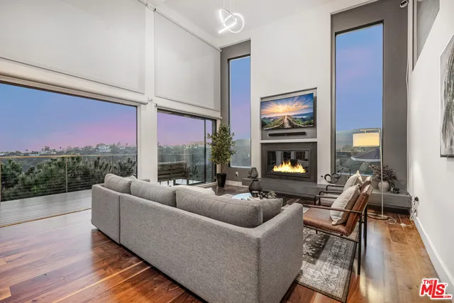 a large white kitchen with a large window