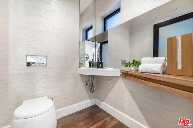 a view of a chair and table in the balcony