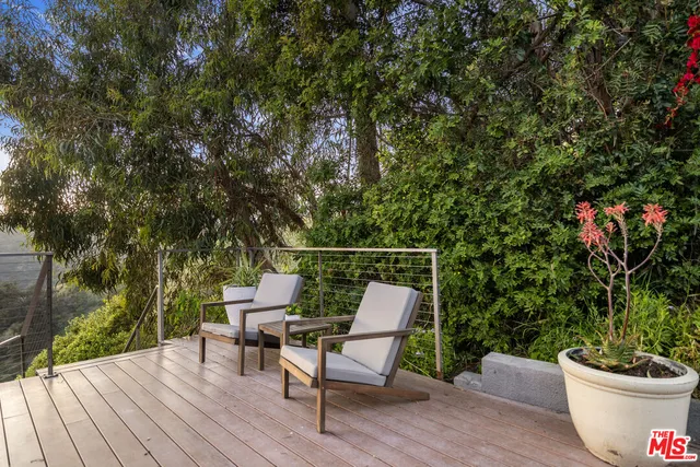 an aerial view of house with yard and outdoor seating