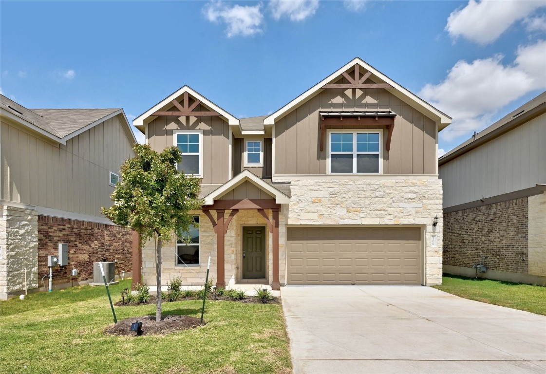 300 Sugar Cane Road Buda, TX 78610 - Photo 1 of 1 a front view of a house with garden