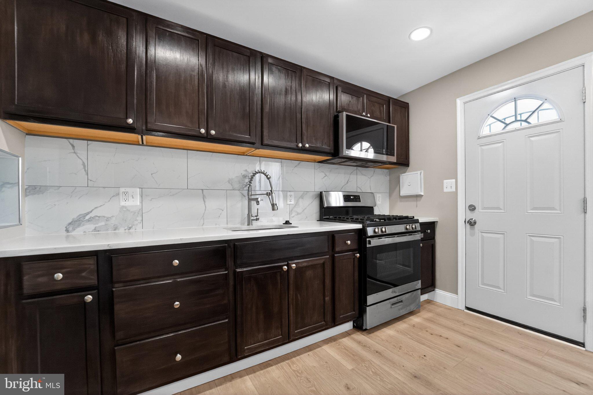 643 South Wickham Road Baltimore, MD 21229 - Photo 10 of 32 Modern kitchen with sleek finishes.