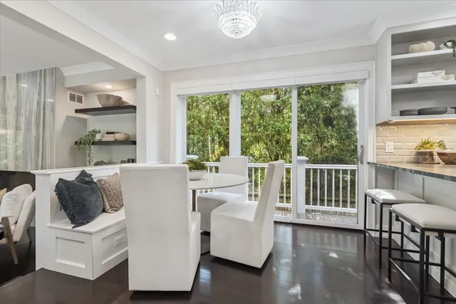 a living room with furniture a rug and a fireplace