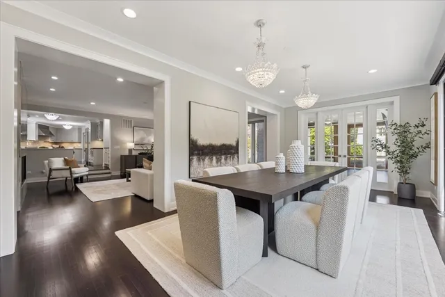 a spacious bedroom with a balcony a bed and wooden floor