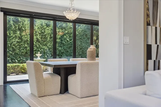 a front view of a house with wooden floor and windows