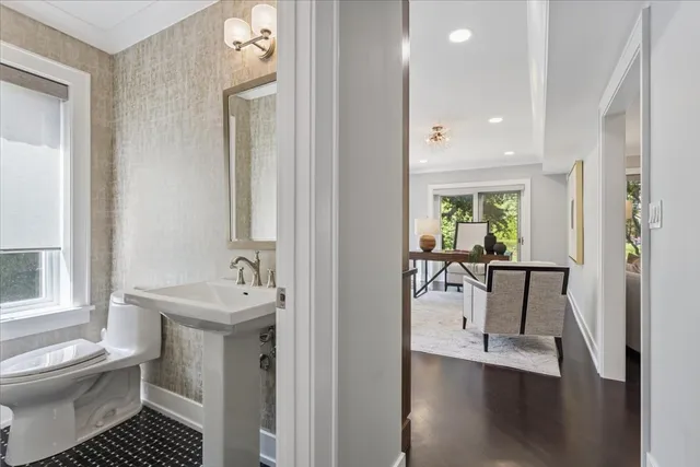 a bedroom with a bed window and a flat screen tv