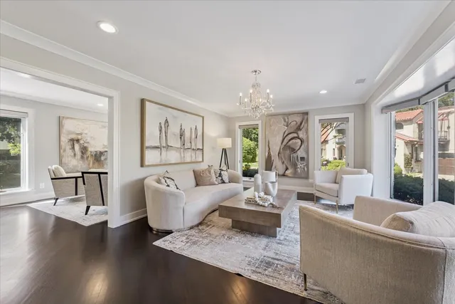 a kitchen with stainless steel appliances granite countertop a stove a sink and white cabinets