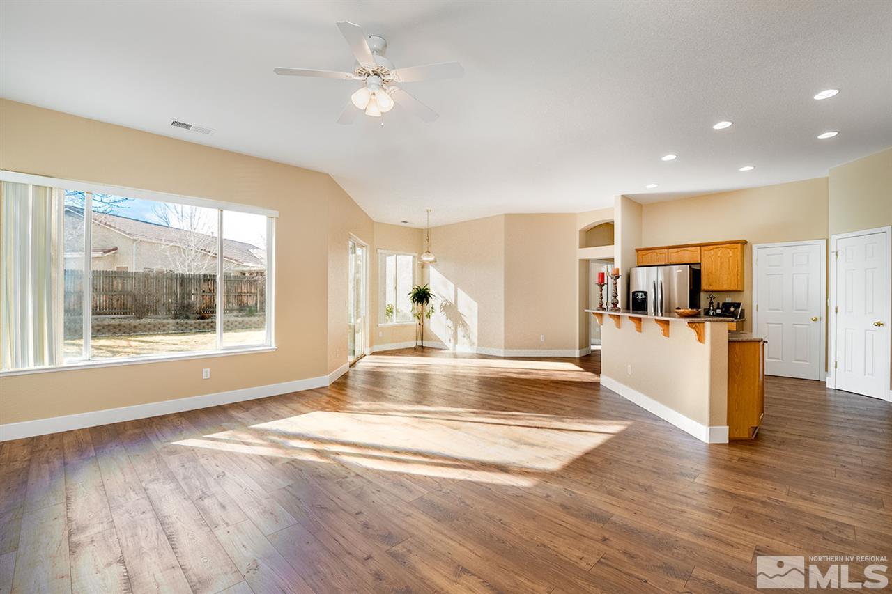 1726 Colavita Way Reno, NV 89521 - Photo 5 of 23 a view of an empty room with kitchen and window