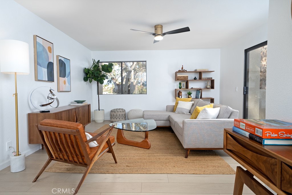 a living room with furniture and a window