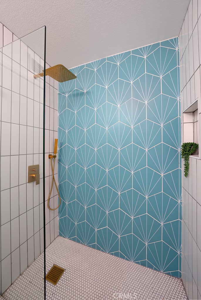 200 East Racquet Club Road, Unit 24 Palm Springs, CA 92262 - Photo 11 of 21 a bathroom with a shower