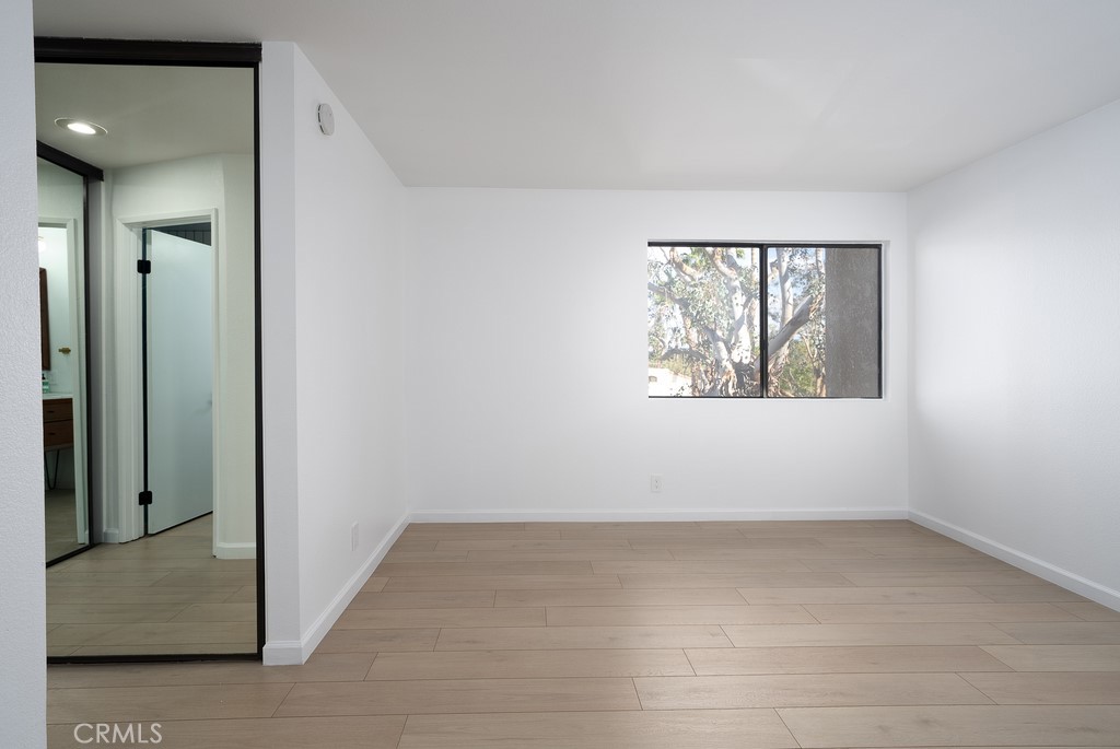 200 East Racquet Club Road, Unit 24 Palm Springs, CA 92262 - Photo 12 of 21 an empty room with a window