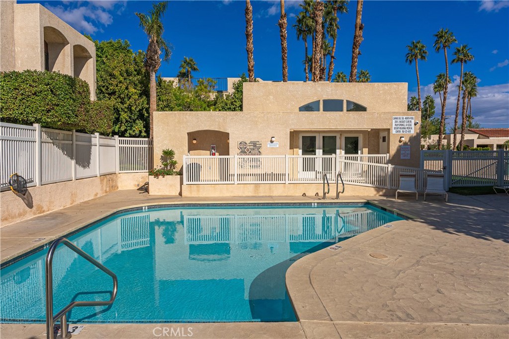 200 East Racquet Club Road, Unit 24 Palm Springs, CA 92262 - Photo 16 of 21 a view of a swimming pool with outdoor seating