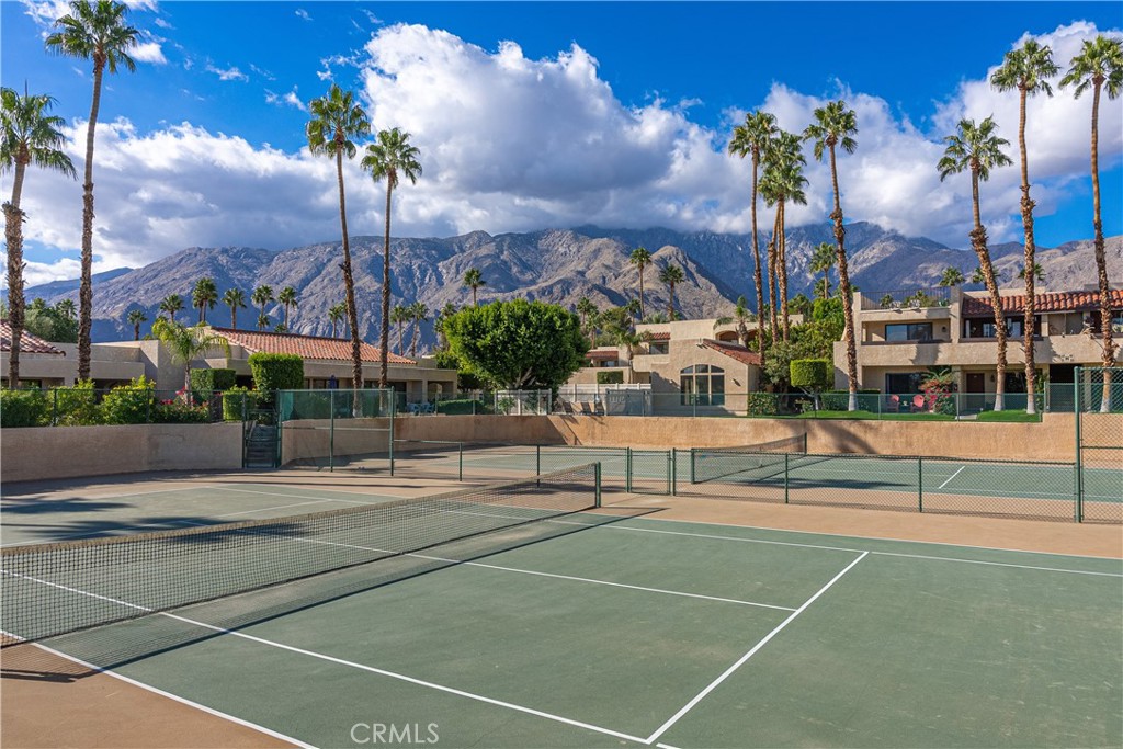 200 East Racquet Club Road, Unit 24 Palm Springs, CA 92262 - Photo 17 of 21 a view of a tennis court